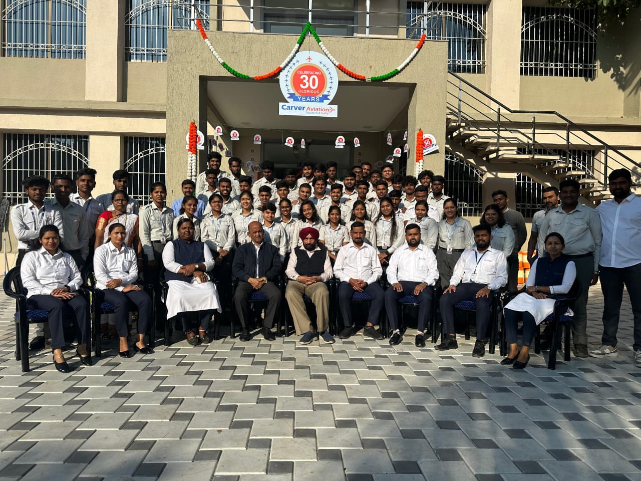 Carver AME students with training aircraft on campus